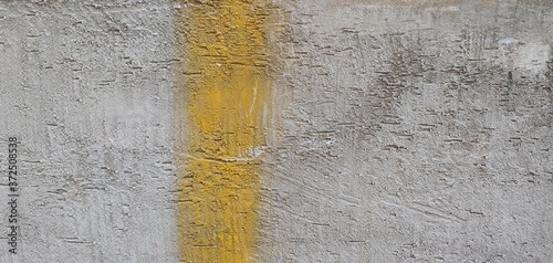 coarse gray walls with yellow vertical line_background