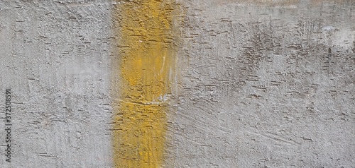coarse gray walls with yellow vertical line_background