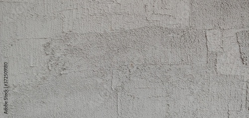 a grey wall with clear brush marks_background