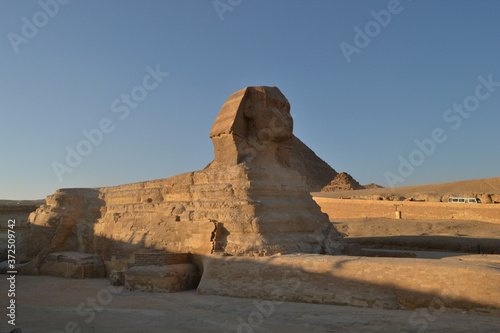 Greatest wonder of the world, the Egypt pyramids and the stone Sphinx on the Giza platou in endless sands of the Sahara desert