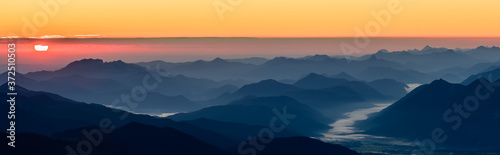 A beautiful and colorful sunrise on the summit of the highest mountain in Germany, Zugspitze at 2962m. 