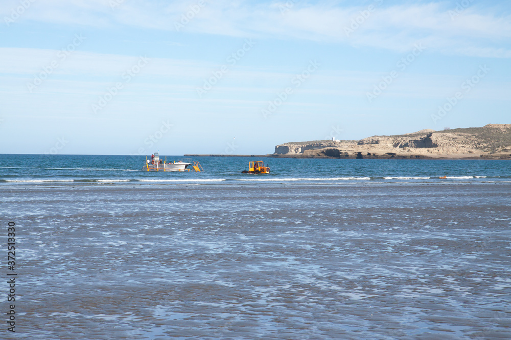 Puerto Piramides beach, on Peninsula Valdes, Argentina, where whale watching excursion boat are launched. Puerto Piramides beach, on Peninsula Valdes, Argentina, where whale watching excursion boat are launched.