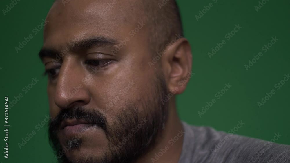 Close Up Of UK Asian Male Rocking Back And Forth. Green Screen Close Up Of UK Asian Male Rocking Back And Forth. Green Screen