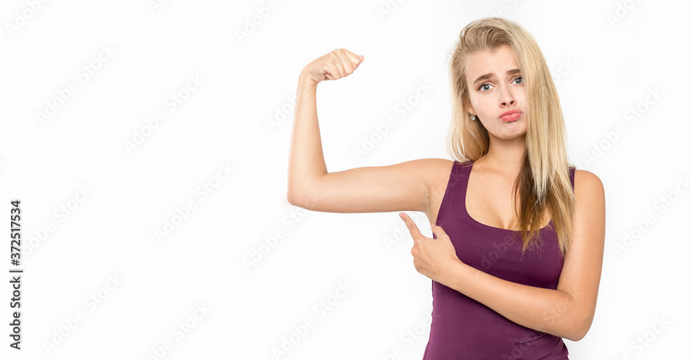 Fototapeta premium Young female with blond hair posing against white background. Emotions.