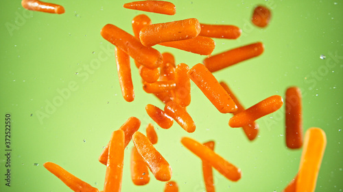 Flying baby carrots isolate...