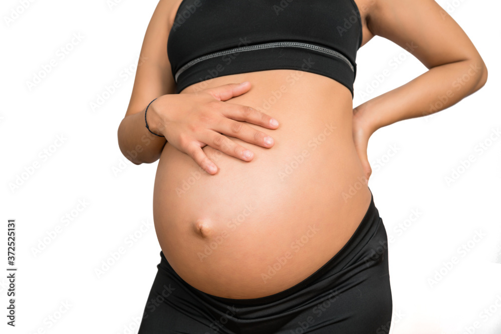 Pregnant woman touching her big belly. Pregnant woman touching her big belly.