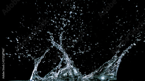 Water splash isolated on black background, freeze motion