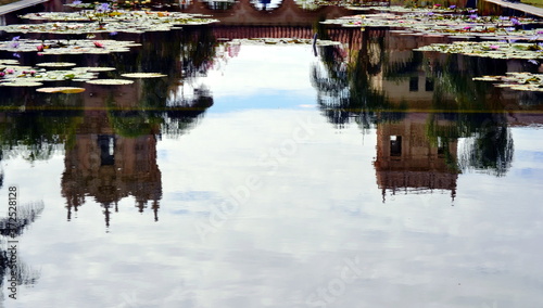 Reflection of two buildings in the water