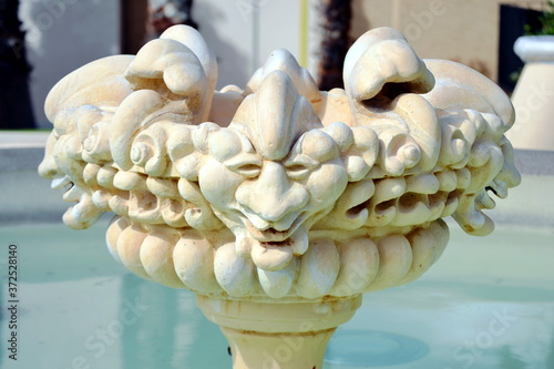 Three faces of a water fountain