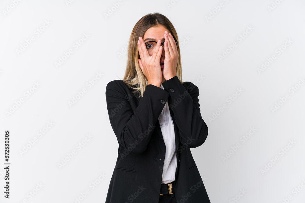 Young business caucasian woman blink through fingers frightened and nervous. Young business caucasian woman blink through fingers frightened and nervous.