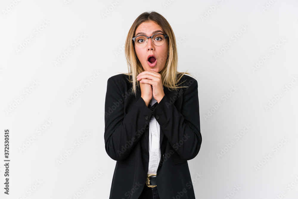 Young business caucasian woman praying for luck, amazed and opening mouth looking to front. Young business caucasian woman praying for luck, amazed and opening mouth looking to front.