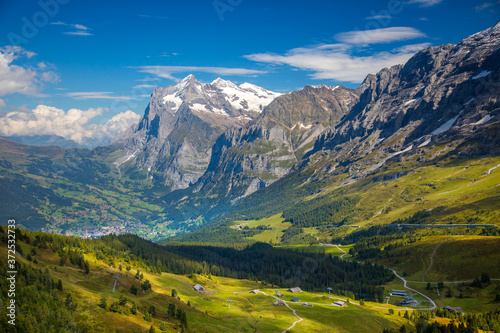View of a high meadow and the Village of Grindelwald, from the Eiger trail, high above Lauterbrunnen, Switzerland.