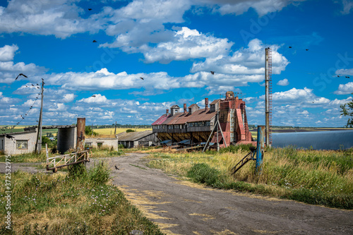 An old abandoned grain Elevator. Forgotten villages. Destroyed agriculture. © VITALII