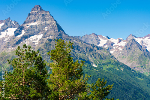 An interesting landscape of mountainous terrain with a difficult and dangerous route. In the distance, you can see the horizon where clouds touch the mountain peaks, virgin nature.