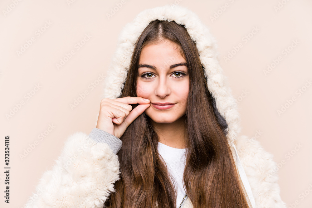 Young caucasian woman posing isolated with fingers on lips keeping a secret. Young caucasian woman posing isolated with fingers on lips keeping a secret.