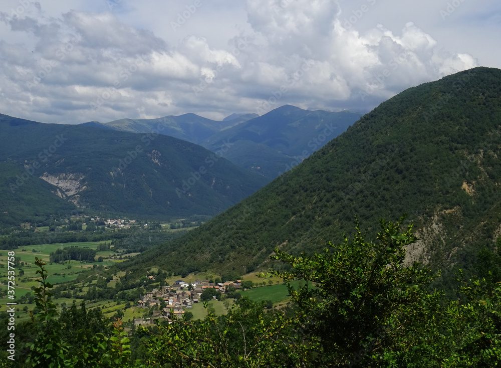Obraz premium Landscape of the Aragon River Valley from the village of Susín and the Pyrenees Mountains in the rear. Huesca. Spain.