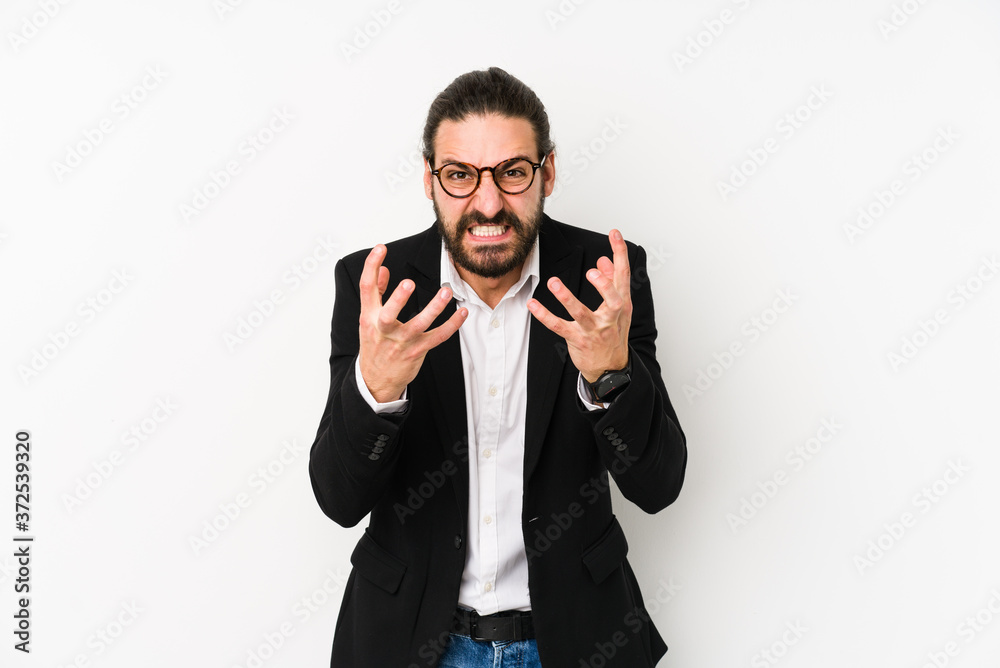 Young caucasian business man isolated on a white background upset screaming with tense hands. Young caucasian business man isolated on a white background upset screaming with tense hands.