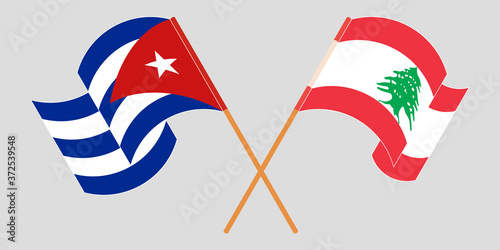 Crossed and waving flags of Lebanon and Cuba