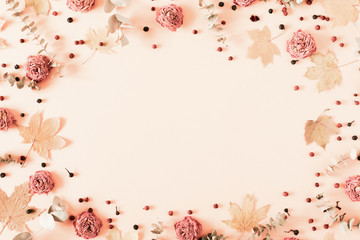 Autumn creative composition. eucalyptus, berries, leaves, roses, flowers on pastel pink background. Thanksgiving Day concept. Fall, autumn background. Flat lay, top view, copy space