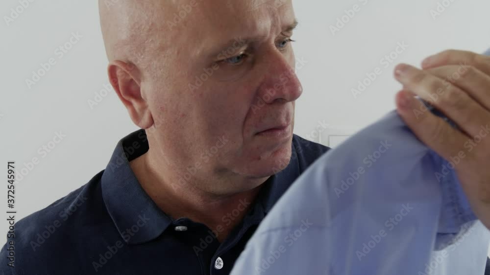 Image with a Man in the Morning Searching in His Personal Wardrobe a Clean Shirt Image with a Man in the Morning Searching in His Personal Wardrobe a Clean Shirt