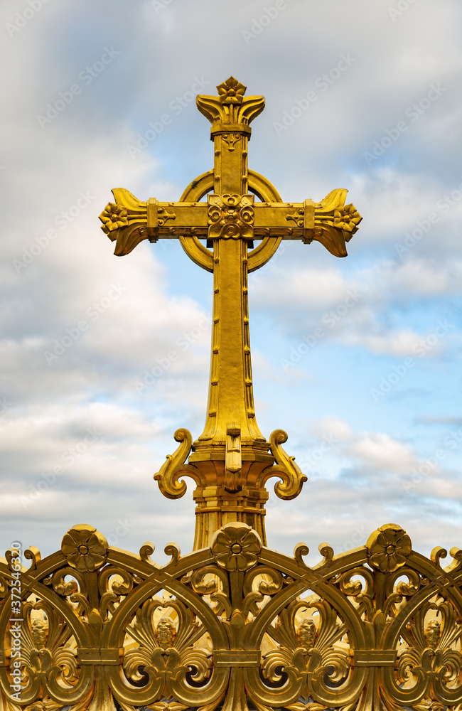 Gilded crown and cross of the dome of the Basilica of Our Lady of the Rosary of Lourdes, France. Gilded crown and cross of the dome of the Basilica of Our Lady of the Rosary of Lourdes, France.