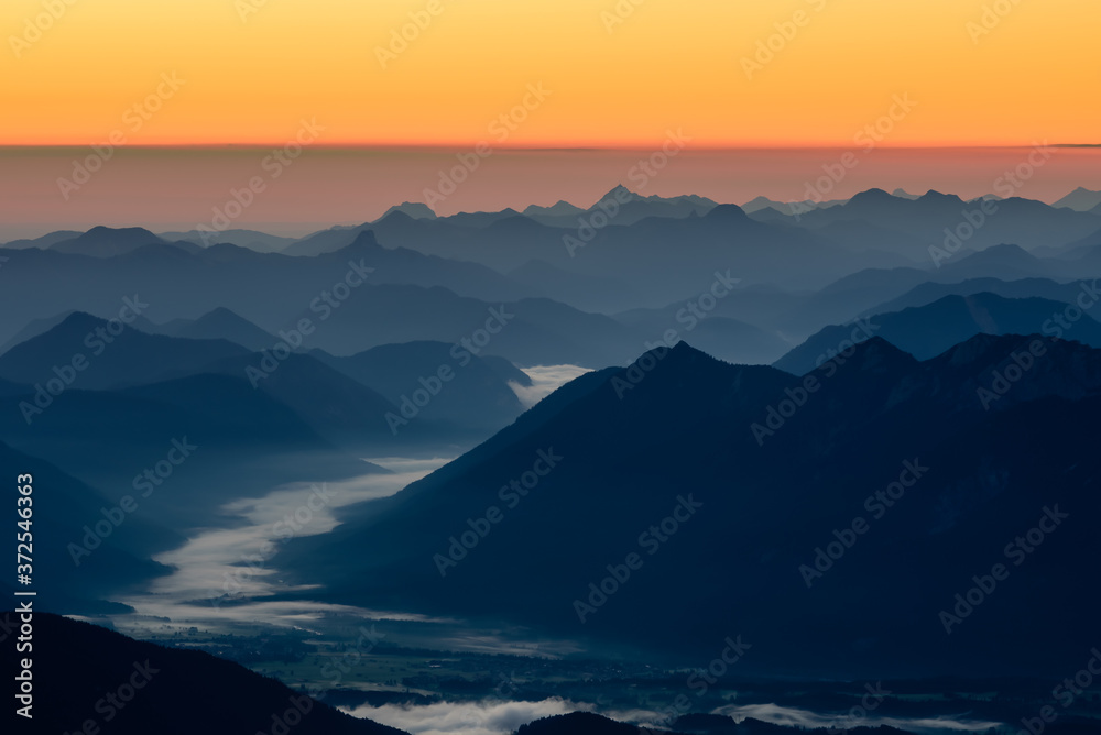 A picture of the sunrise over the alpine moutains range in Germanyfrom  highest peak Zugspitze. 