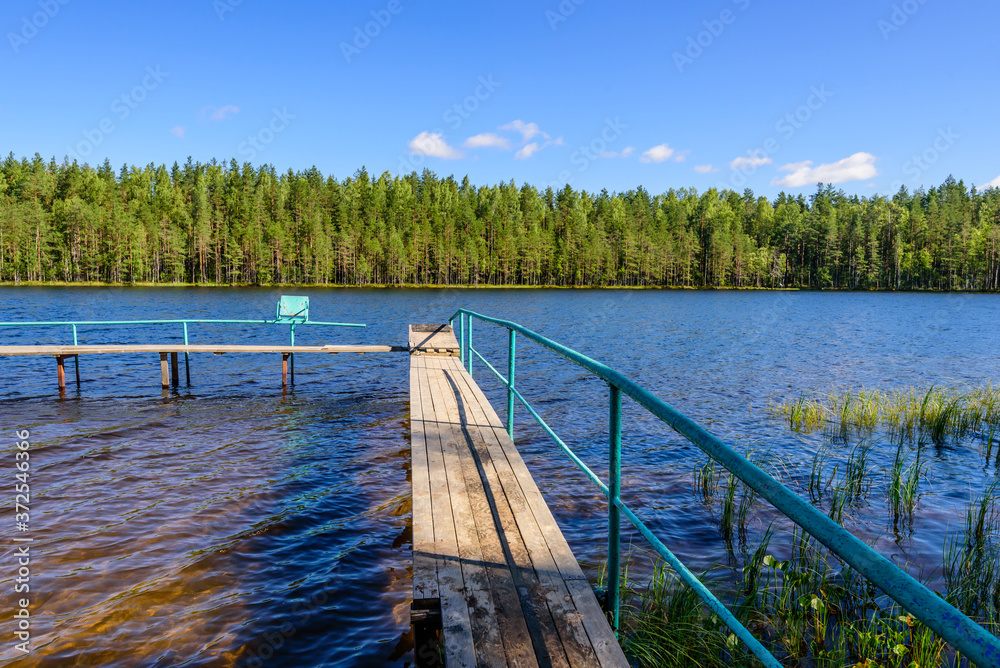 Fototapeta premium Picturesque forest lake, beautiful summer view. Vyaryamyanselkya ridge - environmental route in Leningradskaya oblast, Russia