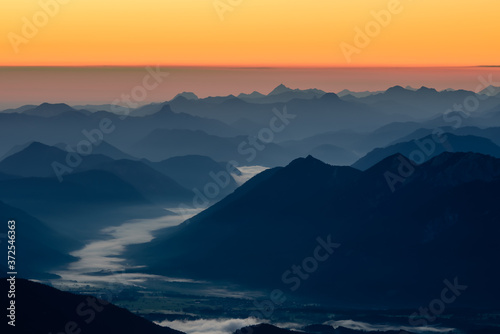 A picture of the sunrise over the alpine moutains range in Germanyfrom highest peak Zugspitze. 