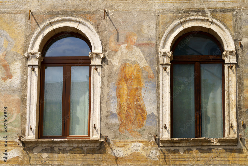 Trento, Italy: painted facade of historic buildings in the cathedral square