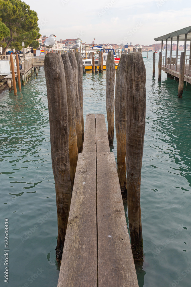 Wooden Pier at Grand Canal in Venice Italy