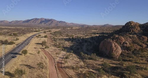 4K aerial drone video of African savanna hills, large red granite boulders range in southern Africa
