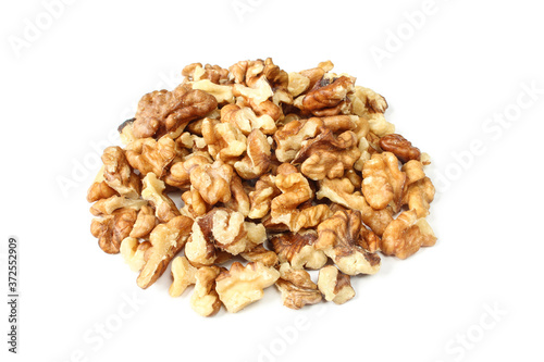 Group of chopped walnut cores isolated on white background.