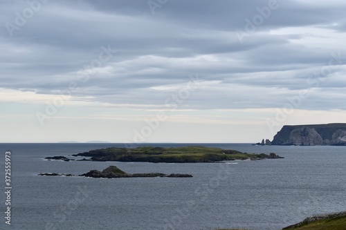 Small island and cliffs of Highlands Scotlands © keremberk