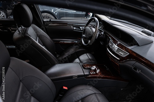 Car interior with black leather seats. Modern car interior.