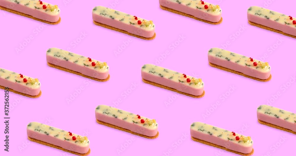 animated seamless pattern with many yellow oblong pastries on a bright pink pastel background, top view
animated seamless pattern with many yellow oblong pastries on a bright pink pastel background, top view