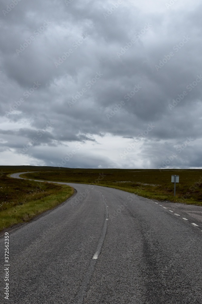Empty roads in the Highlands Scotlands and the grey clouds Empty roads in the Highlands Scotlands and the grey clouds