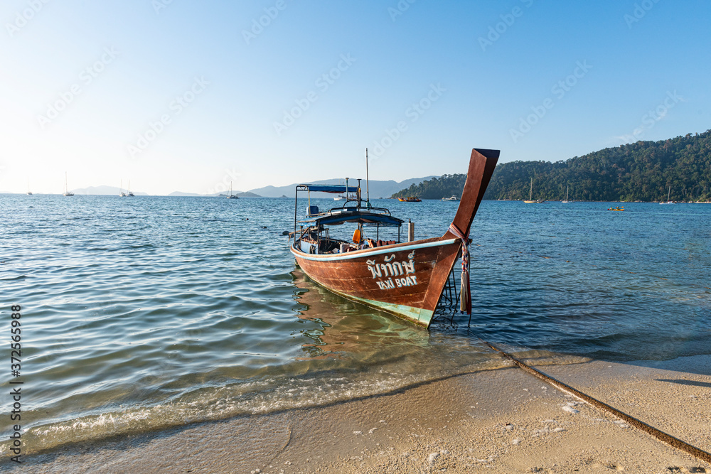Thailand, Satun Province, Ko Lipe, Fishing boat moored at shore of coastal beach Thailand, Satun Province, Ko Lipe, Fishing boat moored at shore of coastal beach