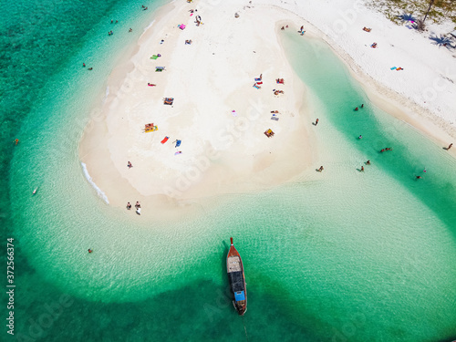 Thailand, Satun Province, Ko Lipe, Aerial view of people relaxing on North Point Beach in summer photo