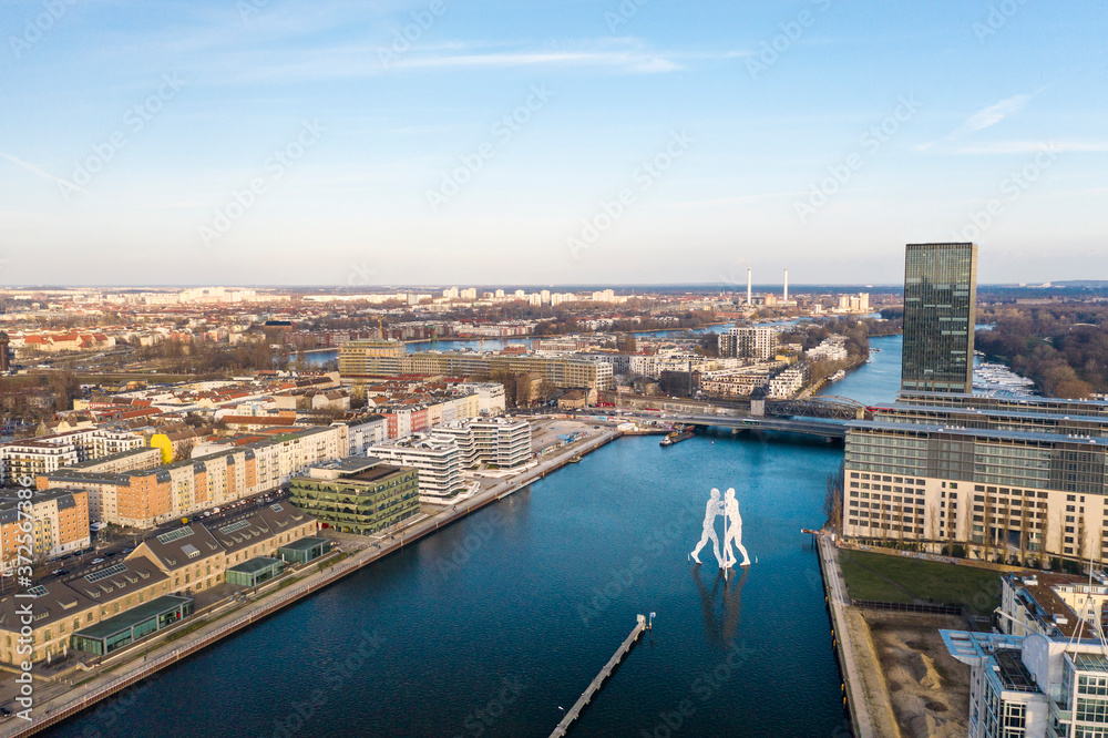 Germany, Berlin, Aerial view of Molecule Man sculpture standing in middle of river Spree canal Germany, Berlin, Aerial view of Molecule Man sculpture standing in middle of river Spree canal