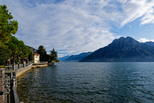 Italy, Lombardy, Riva di Solto, Lake Iseo and mountain photo