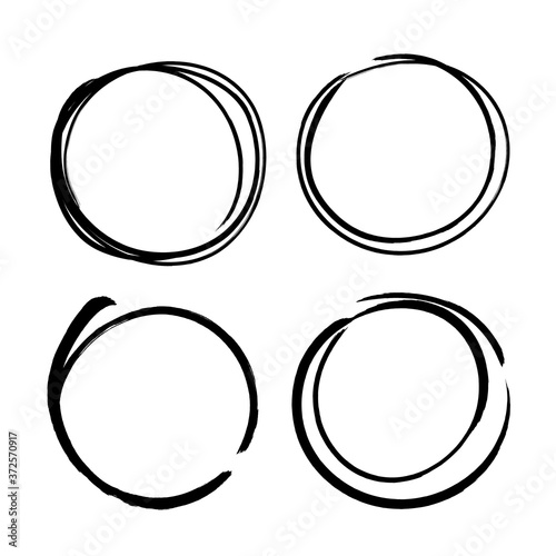 Set of vector circles grunge black borders isolated on white background. A group of labels with uneven rough edges drawn with an ink brush. Vector design elements, 4 circle frames. Grunge borders