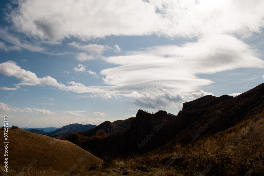 Lenticular clouds over mountains in Bolshoy Tkhach national park