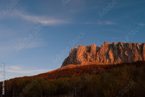 Red cliff in sunset in Caucasus mountains