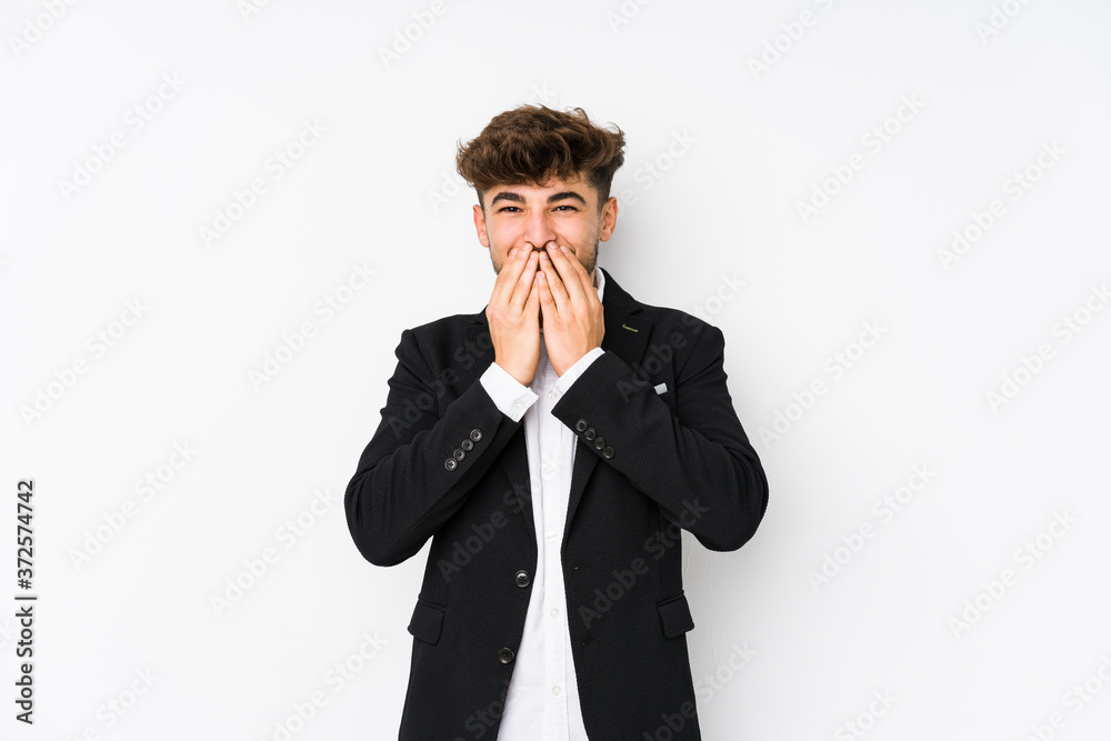 Young arabian business man isolated laughing about something, covering mouth with hands. Young arabian business man isolated laughing about something, covering mouth with hands.
