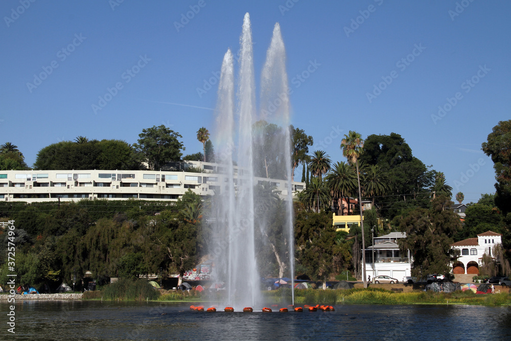 In city park with Lake has three water fall peaks
