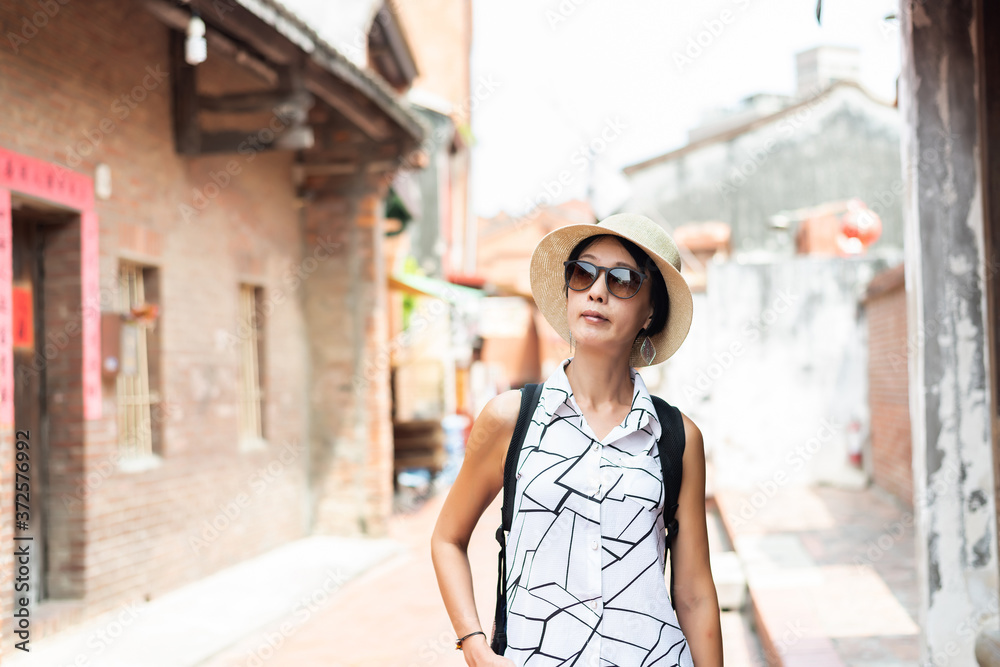 woman walking in the old street at Lukang town