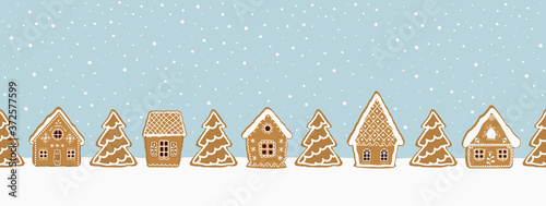 Gingerbread village. Christmas background. Seamless winter border. There are gingerbread houses and fir trees on a blue background. Greeting card template. Vector illustration