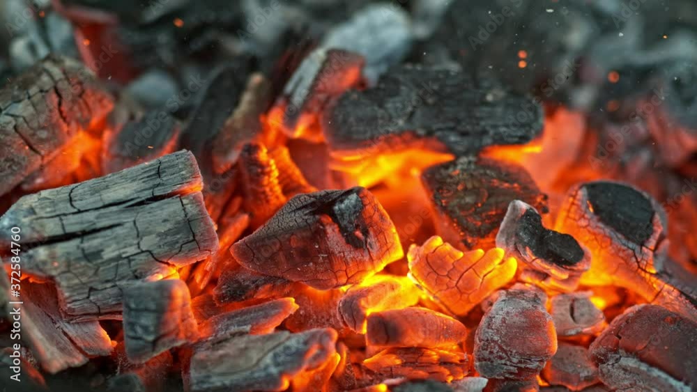 Black charcoal in bonfire, super slow motion shooting on high speed camera at 1000fps Black charcoal in bonfire, super slow motion shooting on high speed camera at 1000fps
