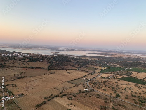 Hot air balloon flight at sunrise  Aerial View over the great Alqueva lake  in Alentejo  Portugal