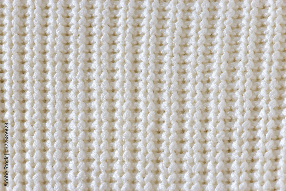 White knitted wool texture background. White knitted wool texture background.